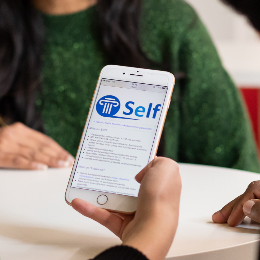 The Self-service is displayed on the mobile phone.