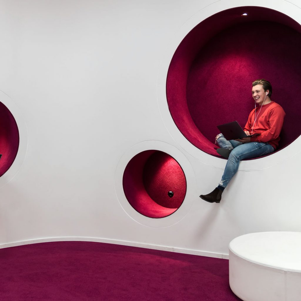 A student sitting on a sofa