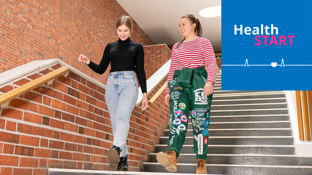 Two students on the stairs and the HealthStart logo.