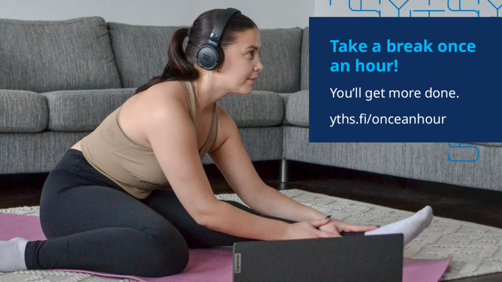 A student stretching while they listen to an online class.